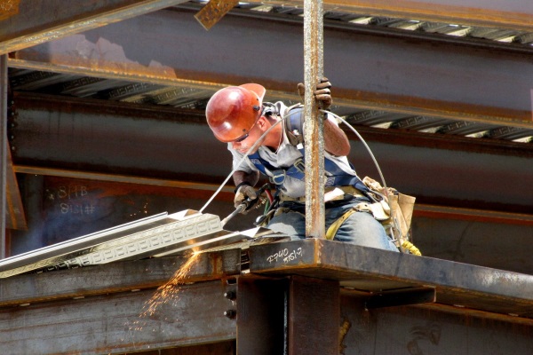 a roofer using heat welds to install PVC or modified bitumen roofs